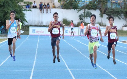<p>Veruel Verdadero of Dasmarinas City (second from right) in action during the boys' 200-meter run. <em>(Photo courtesy of PATAFA)</em></p>